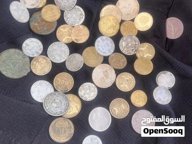 عملات نقدية من فترات زمنية مختلفة اقدمها مند 1876 ميلادي - مراكش